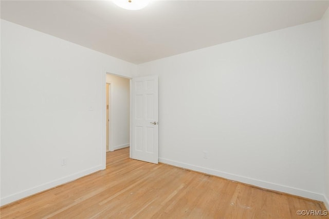 spare room with light wood-type flooring