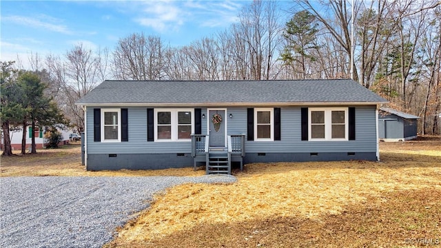 view of front of property featuring crawl space and roof with shingles