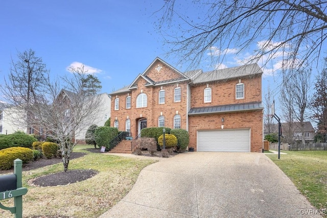 view of front of home featuring a garage and a front yard