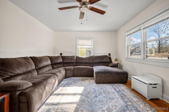 living room featuring ceiling fan, plenty of natural light, and hardwood / wood-style floors