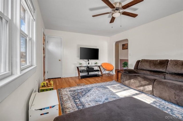 living room with hardwood / wood-style flooring and ceiling fan