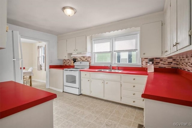 kitchen featuring tasteful backsplash, sink, white appliances, and white cabinetry