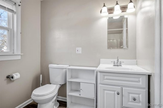 bathroom with toilet and vanity