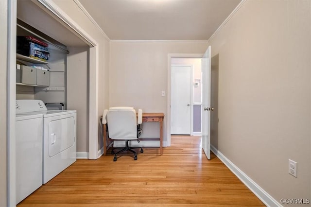 laundry room featuring cabinets, separate washer and dryer, crown molding, and light wood-type flooring