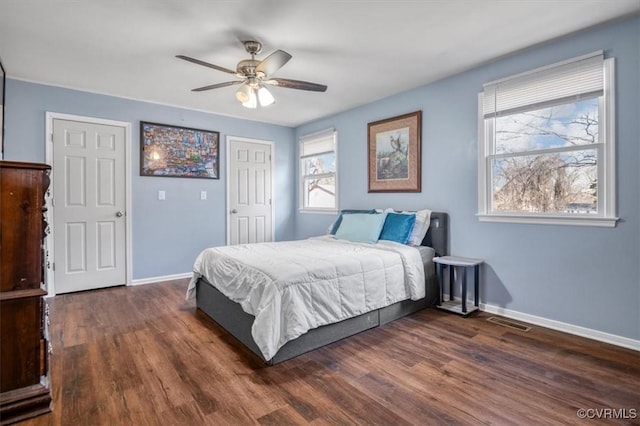 bedroom featuring ceiling fan and dark hardwood / wood-style floors