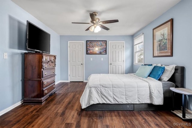 bedroom with dark wood-type flooring and ceiling fan