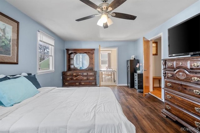 bedroom with ceiling fan and dark hardwood / wood-style floors