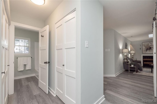 hallway with light wood-type flooring