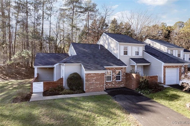 front of property with a garage and a front yard