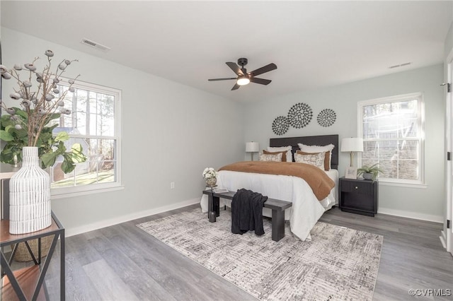 bedroom with ceiling fan and wood-type flooring