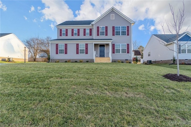 view of front of home featuring cooling unit and a front yard