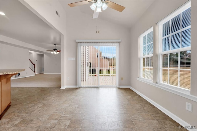 spare room featuring ceiling fan and vaulted ceiling