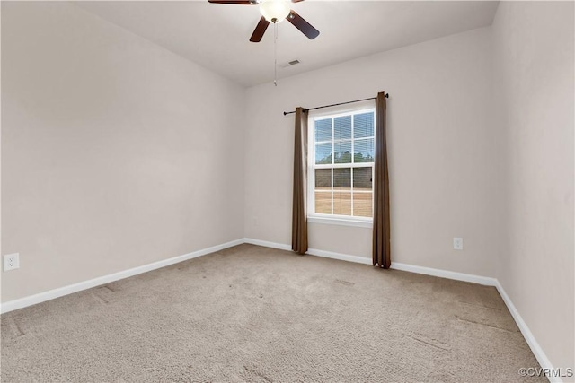 empty room featuring ceiling fan and carpet flooring