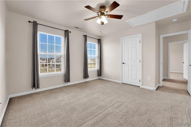 carpeted empty room with ceiling fan