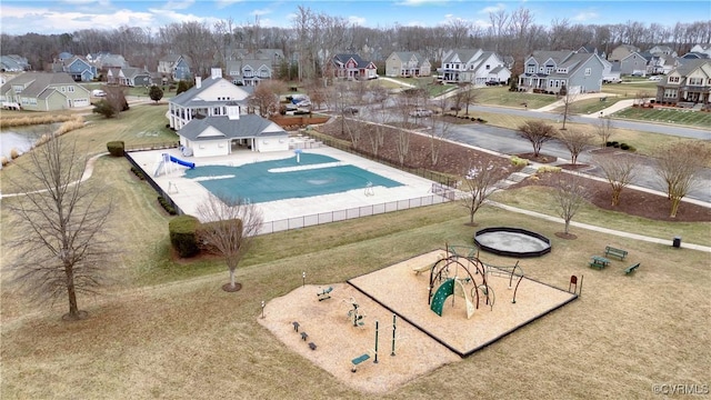 view of pool with a playground