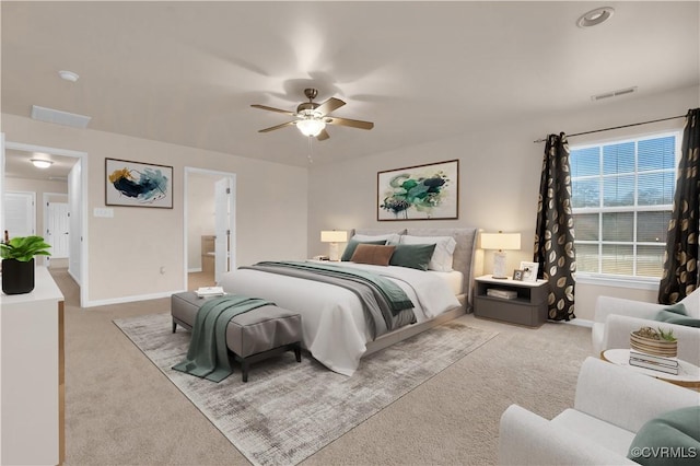 carpeted bedroom featuring ensuite bathroom and ceiling fan