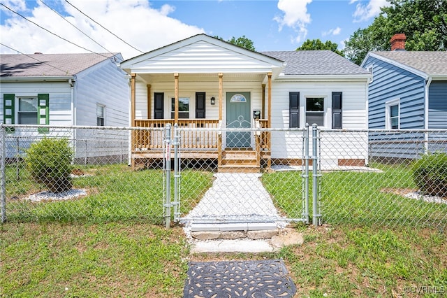 bungalow-style home with a front lawn and a porch