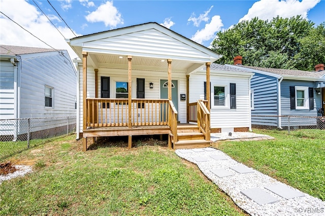 view of front facade with a front lawn and a porch