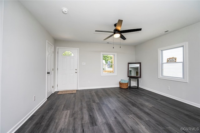 interior space with ceiling fan and dark hardwood / wood-style floors