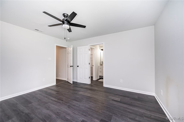 unfurnished bedroom with ceiling fan and dark hardwood / wood-style flooring