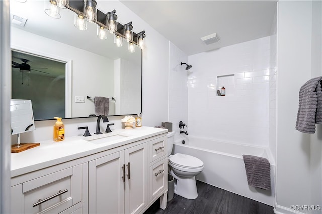 full bathroom with shower / bathing tub combination, vanity, toilet, and hardwood / wood-style floors