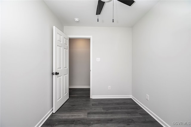 unfurnished room featuring ceiling fan and dark hardwood / wood-style floors