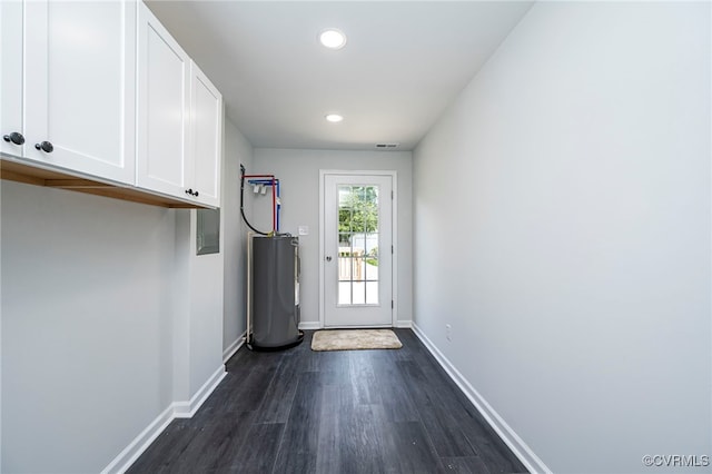 doorway with dark hardwood / wood-style floors and electric water heater