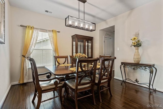 dining space featuring dark hardwood / wood-style flooring