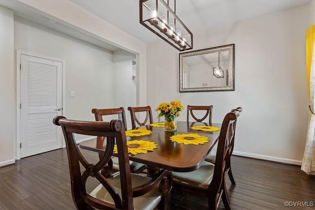 dining room with dark wood-type flooring