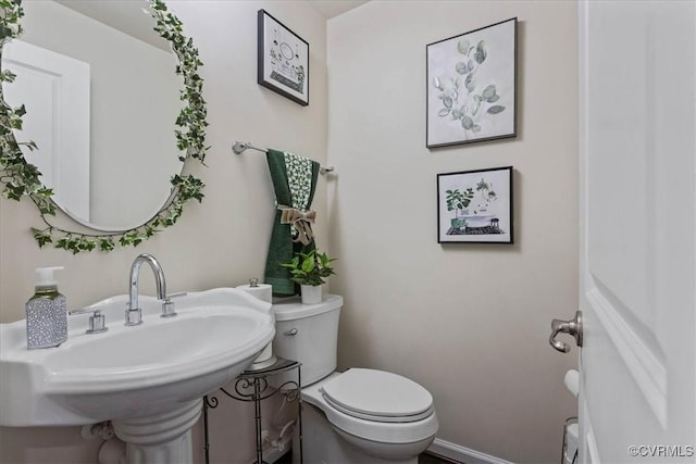 bathroom featuring sink and toilet