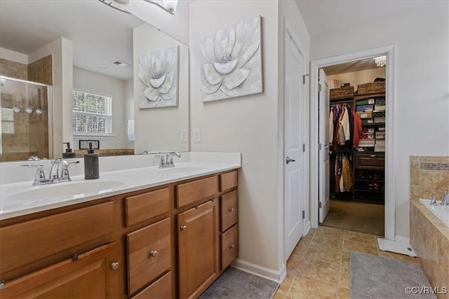 bathroom featuring vanity and separate shower and tub