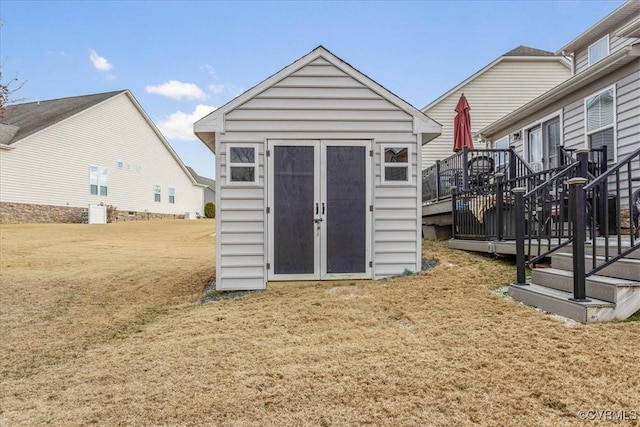 view of outbuilding featuring a yard