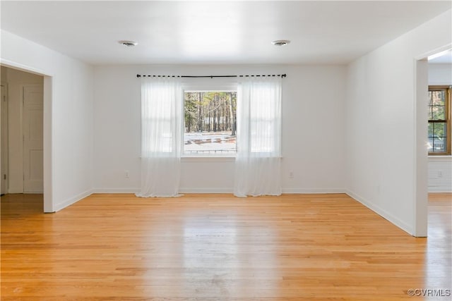 unfurnished room featuring light hardwood / wood-style flooring