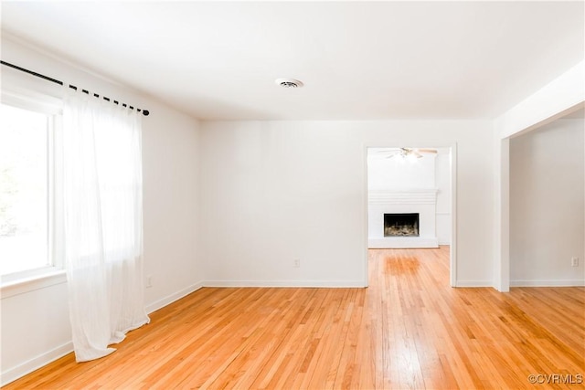 unfurnished living room with hardwood / wood-style flooring