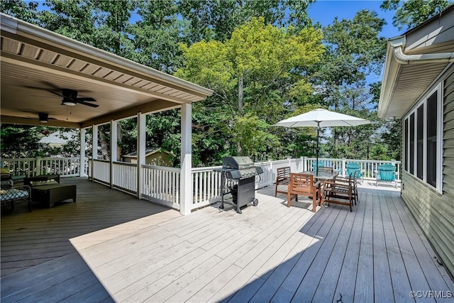 deck with area for grilling and ceiling fan