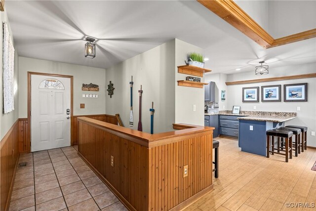 interior space featuring a breakfast bar area and kitchen peninsula