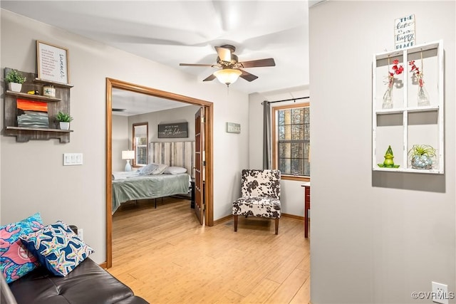 bedroom with hardwood / wood-style flooring and ceiling fan