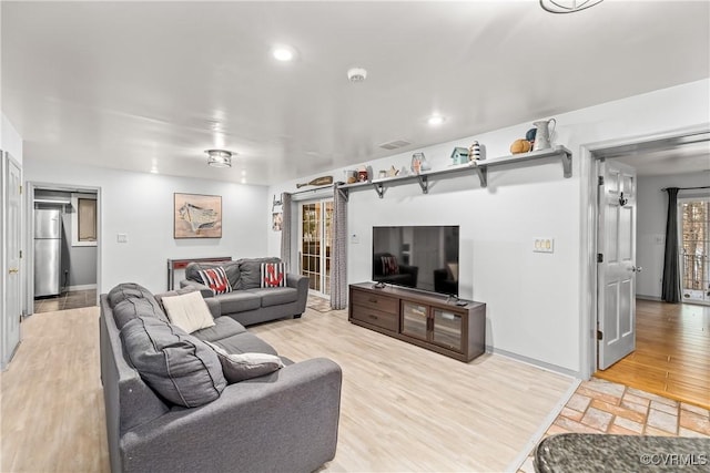 living room with light hardwood / wood-style floors