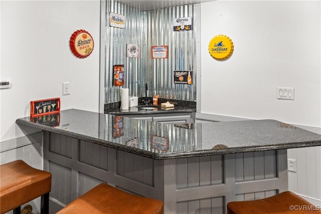 bar with dark stone counters