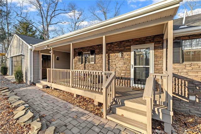 entrance to property featuring a porch