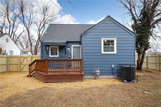 back of house with a wooden deck and central AC unit