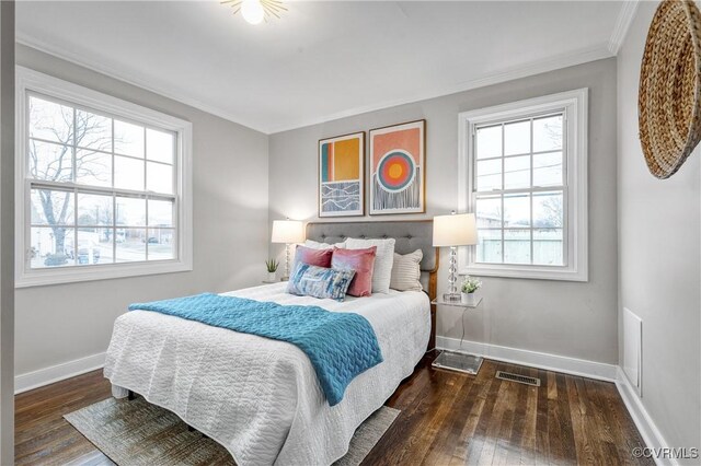 bedroom featuring dark wood-type flooring and ornamental molding