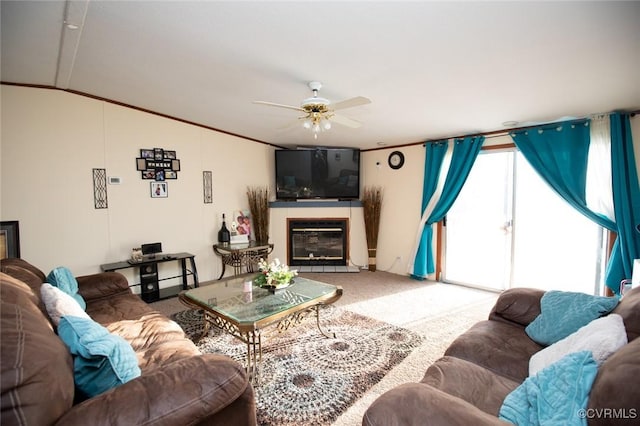 carpeted living room featuring ceiling fan, vaulted ceiling, and crown molding