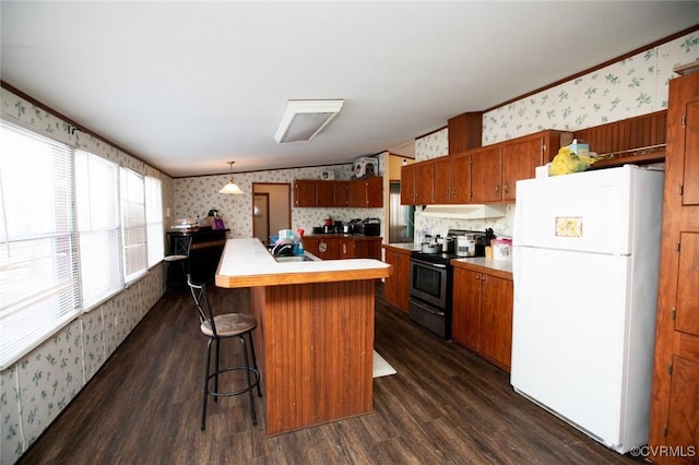 kitchen featuring dark hardwood / wood-style floors, a center island with sink, hanging light fixtures, stainless steel electric range oven, and white refrigerator