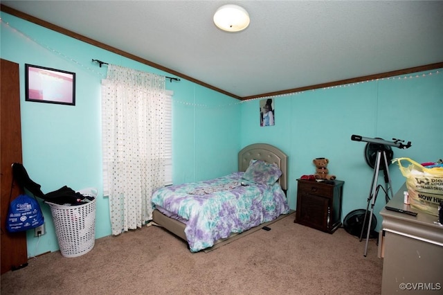 carpeted bedroom featuring vaulted ceiling and crown molding