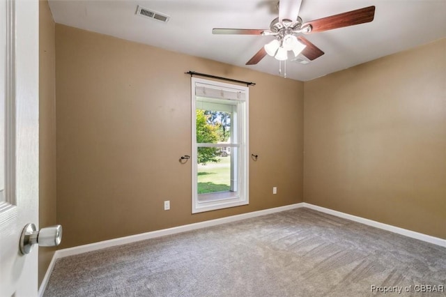 empty room with carpet and ceiling fan