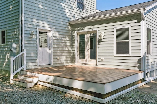 property entrance featuring french doors and a wooden deck