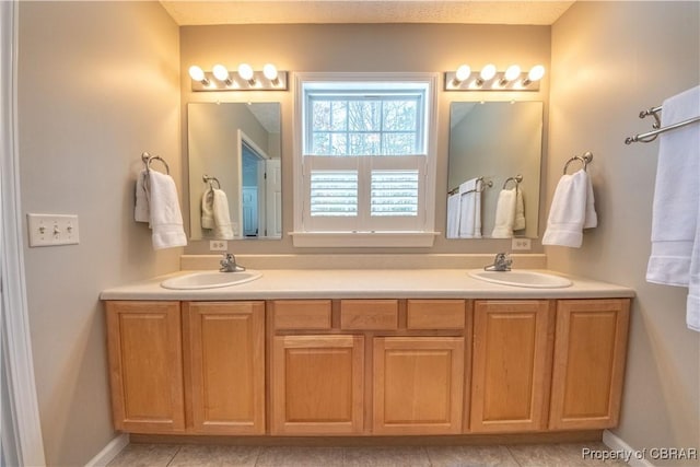 bathroom with vanity and tile patterned flooring