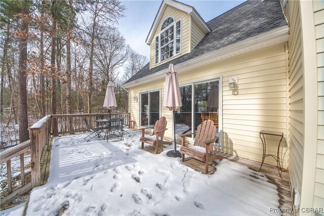 view of snow covered deck