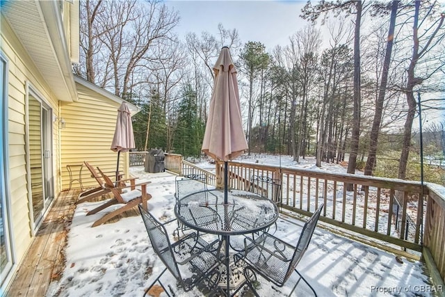 view of snow covered deck